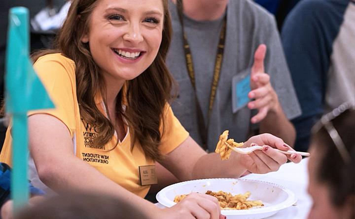 Image of Student Eating Pasta